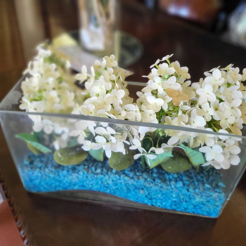 Modern arrangement with artificial hydrangeas in glass vase