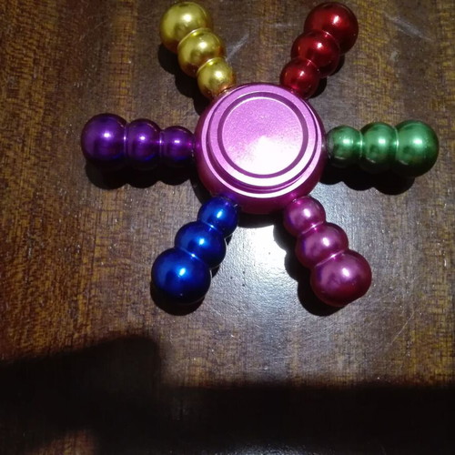 Metal fidget spinner ship wheel like new, rainbow colors