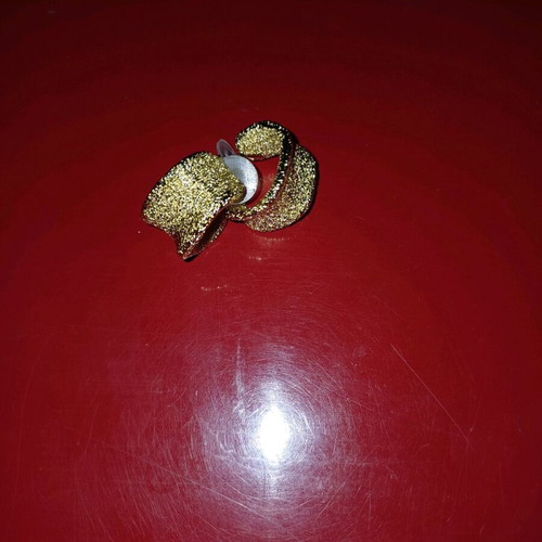 Earrings with textured surface in yellow color like new
