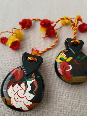 Vintage wooden castanets with hand-painted designs