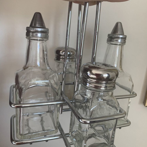 Vintage oil and vinegar set with salt and pepper shakers on metal stand like new