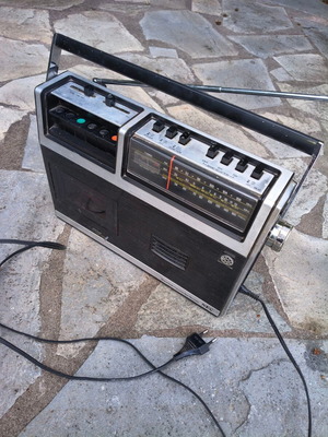 Vintage analog radio cassette player used, functional
