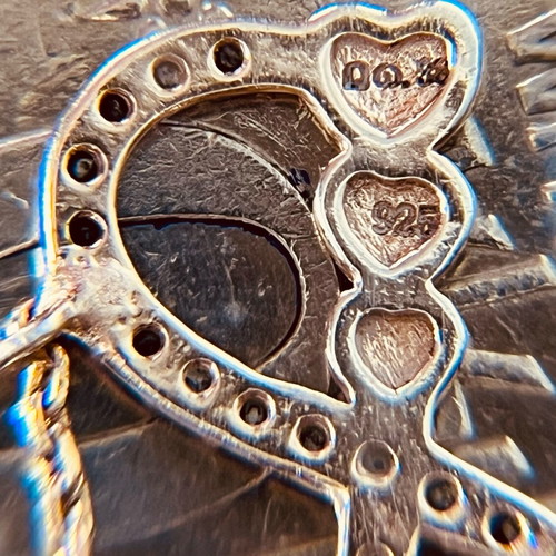 Silver 925 necklace with gold vermeil coating, infinity design with gold hearts, used