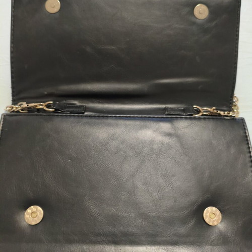 Black clutch bag with gold chain used, synthetic leather