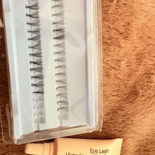 Eyelash tuferkia with adhesive used