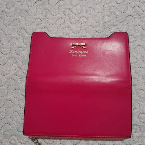 Pink wallet like new with few marks on front