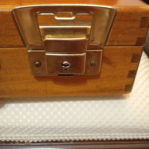 Vintage wooden suitcase made of genuine teak wood, used