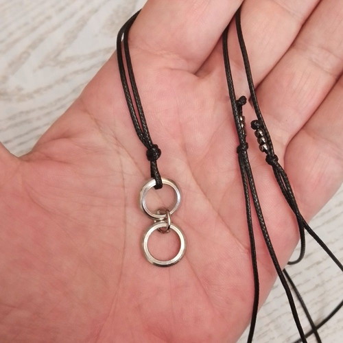 Men's black pendant with silver circles