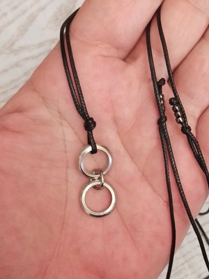 Men's black pendant with silver circles