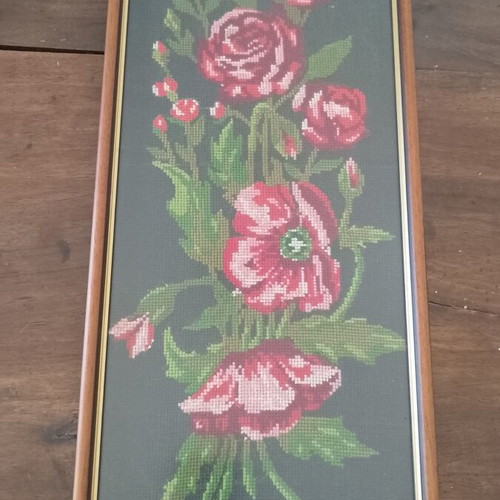 Vintage cross stitch picture of roses and poppies