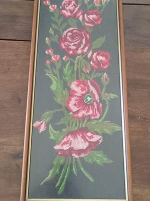 Vintage cross stitch picture of roses and poppies