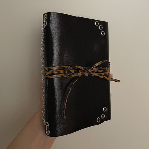 Handmade leather journal with customizable inserts and charm