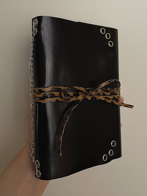 Handmade leather journal with customizable inserts and charm