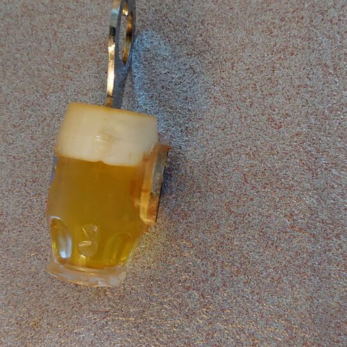 Decorative bottle opener used with wear around the magnet