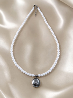 Short necklace with white beads and silver steel pendant like new