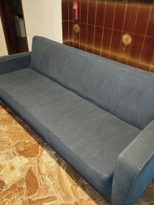 Three-seater sofa used with storage space blue convertible to bed