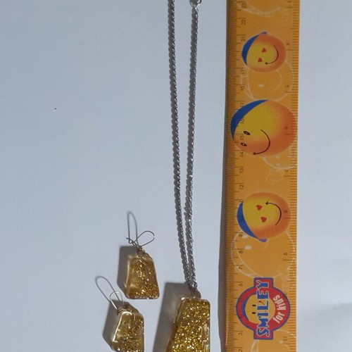 Set of 7 handmade pendant and earring jewelry sets with resin and dried herbs