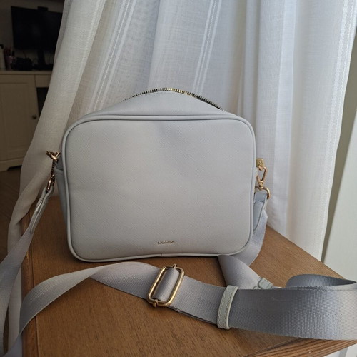 Carpisa bag like new, soft blue with gold details