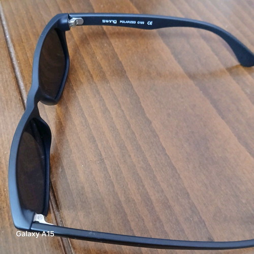 Swing sunglasses new with black plastic frame and men's lenses