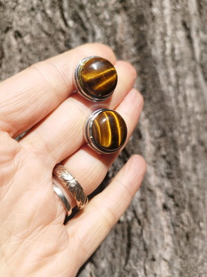 Vintage cufflinks used, decorated with natural tiger eye stone