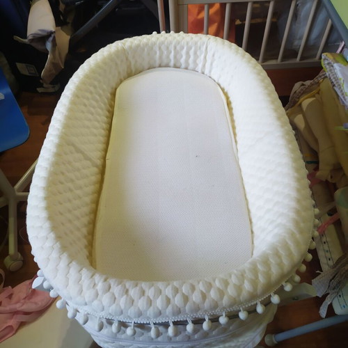 Bassinet on wooden base with wheels like new