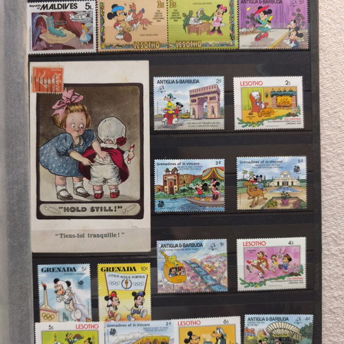 Disney collectible album with 220 stamps and 16 cards
