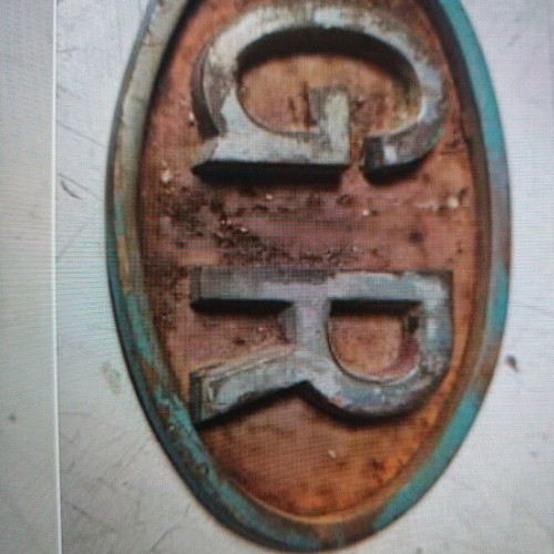 GR metal car emblem used, needs maintenance