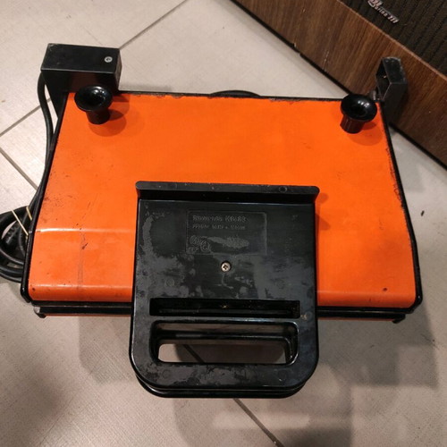 Rowenta vintage sandwich maker used with enamel surfaces orange color