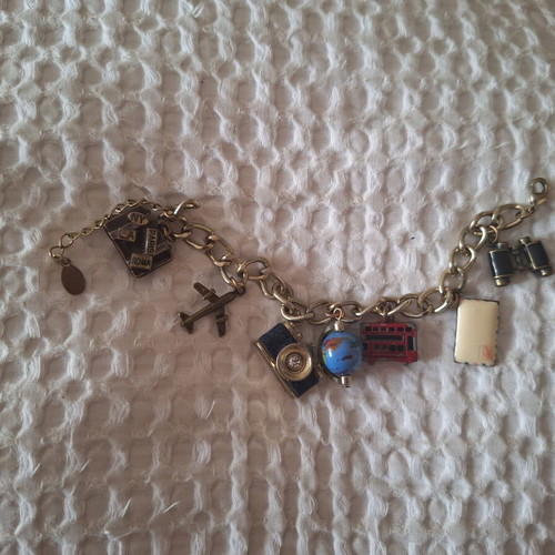 Travel-themed necklace new with globe and camera charms