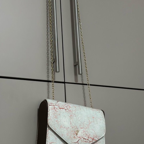 Axel bag new with marble effect and chain strap