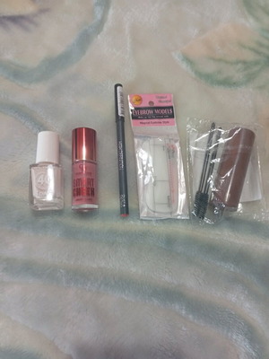 Cosmetic set beige nail polish, liquid blush, lip pencil, stencil and eyebrow dye new