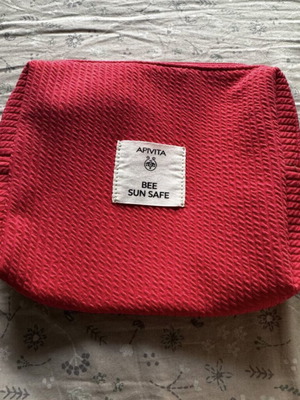 Apivita Bee Sun Safe toiletry bag, red