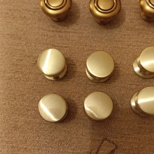 Handles and knobs for cabinets and drawers used, 24 pieces gold and silver