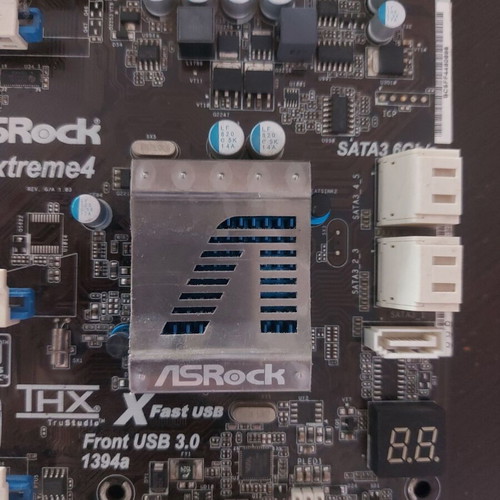 AsRock 970 Extreme4 AM3+ motherboard used, functional with updated BIOS