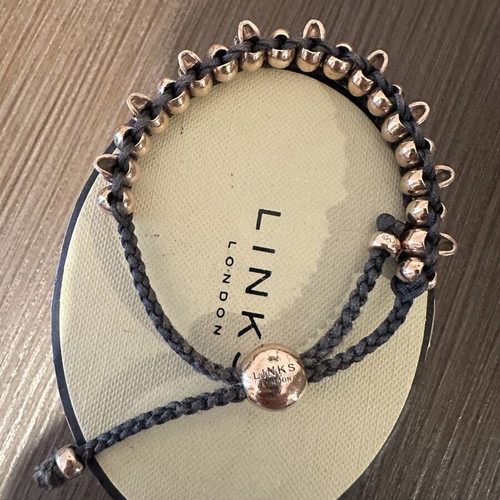 Links Of London collectible bracelet like new, rose gold and black cord