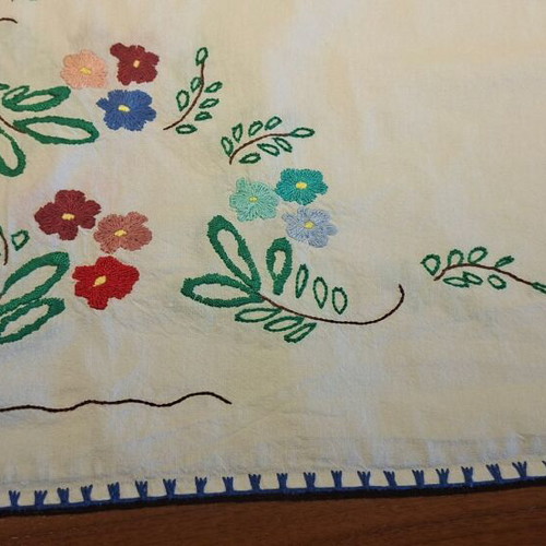 Vintage handmade embroidered tablecloth with flowers and needlework