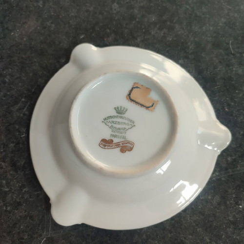 Vintage porcelain ashtray used with romantic scene and gold details
