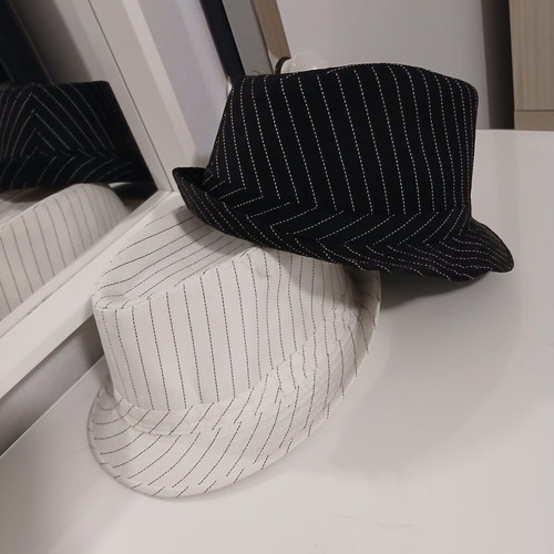 Hats like new, black and white, one size
