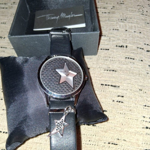 Thierry Mugler wristwatch with leather strap and silver star charm