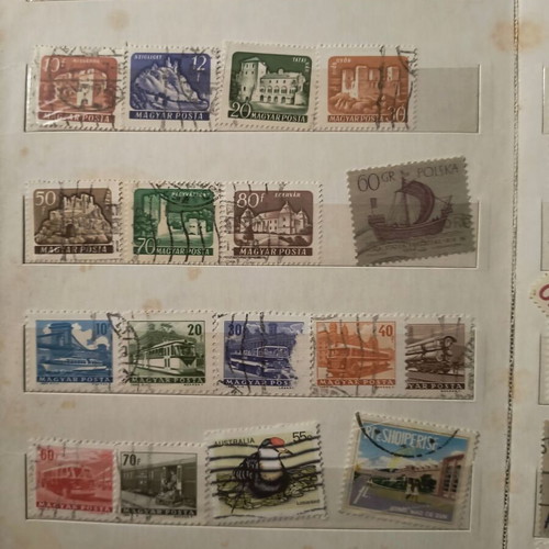 Stamp album like new with about 500 mostly foreign stamps