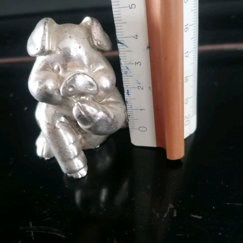 Silver piglet figurine used, not solid silver