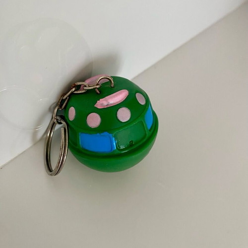 Vintage UFO keychain inflatable flying saucer like new, green