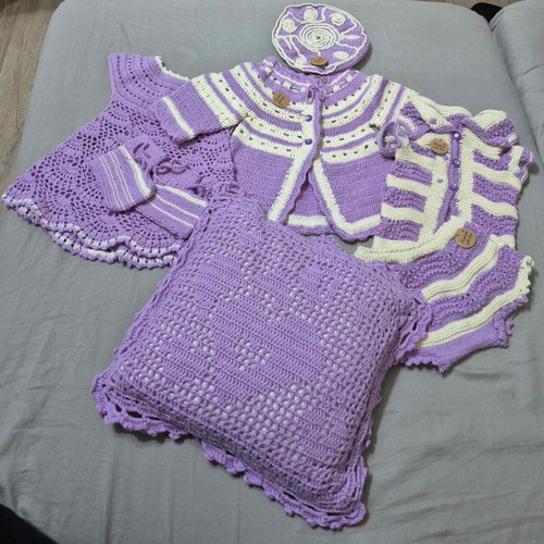 Handmade baby clothing set with dress, cardigan, hat, and pillow, size up to 12 months