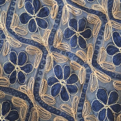 Blue embroidered decorative square used with gold thread