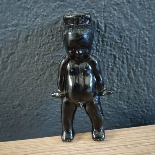 Vintage black plastic boy figure used
