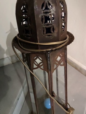 Metal vintage decorative garden lantern used with blue lighting