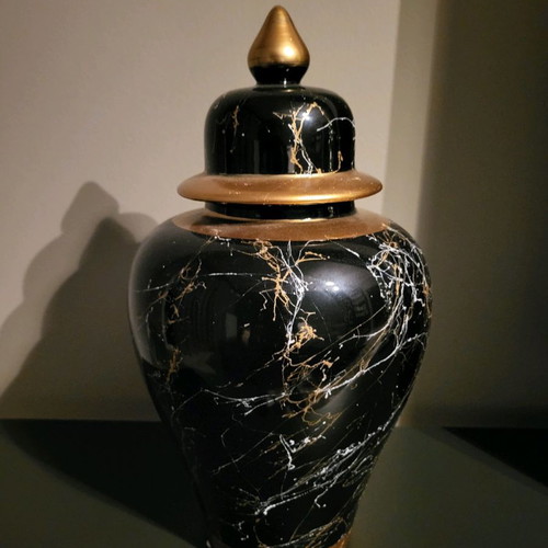 Decorative vase used with lid, black marble look and gold details