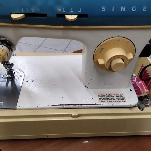 Singer sewing machine used, portable with frame damages