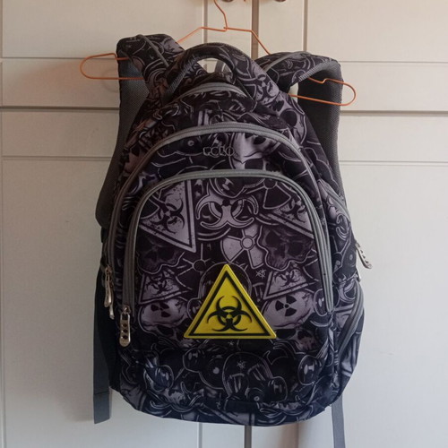 Polo character school backpack with multiple compartments