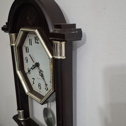 Quartz wall clock with pendulum used, faux wood plastic